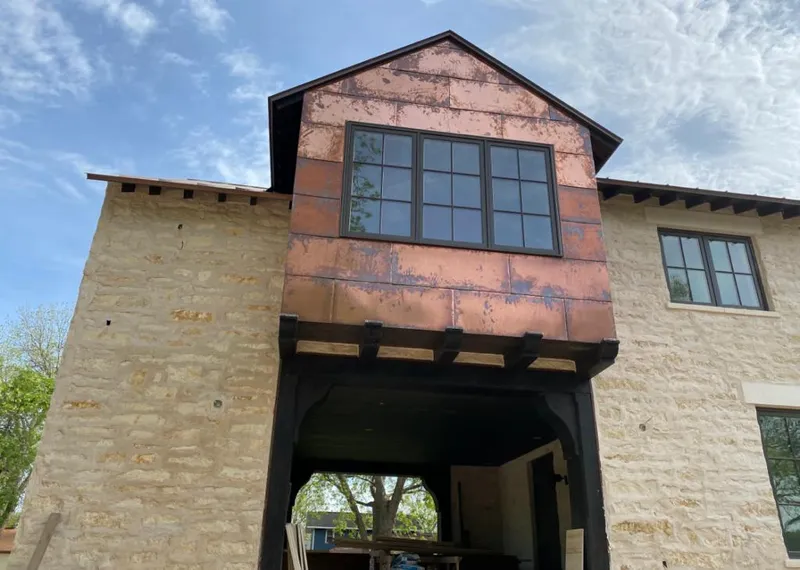 Copper metal panel facade on a stone building for Skylight Installation in Phenix City